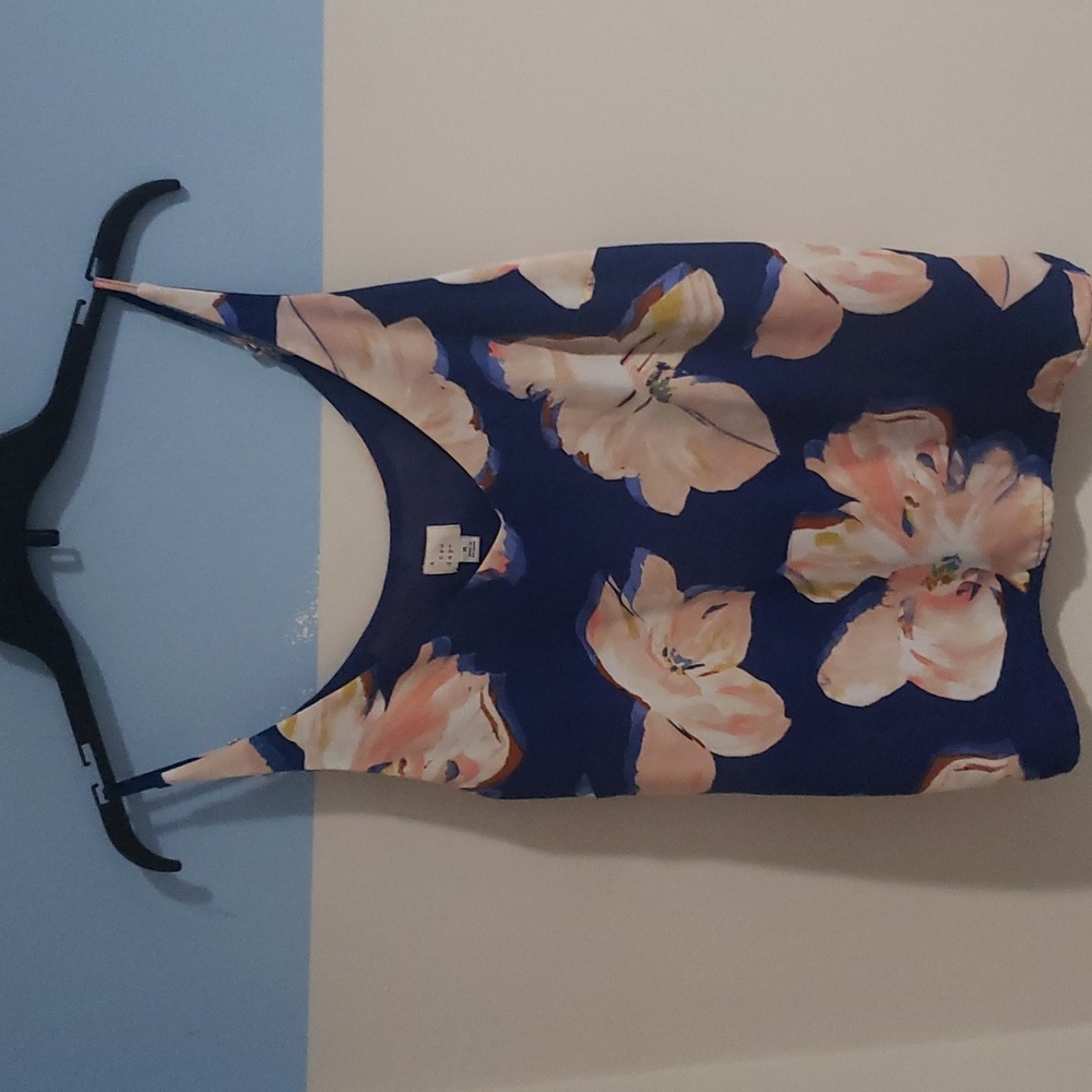 a.  new day, blue flowered blouse, size "M".